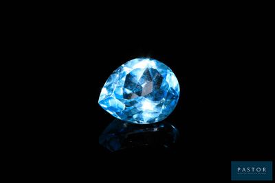 a blue diamond on a black background