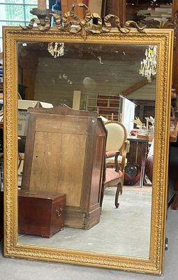 a large mirror sitting on the floor in a room