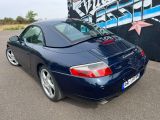 a blue sports car parked in a parking lot