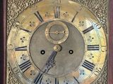 a clock with roman numerals on the face of it