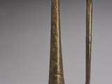 an old brass trumpet with a brass handle and a brass bell
