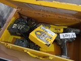 a yellow box with tools in it sitting on a table