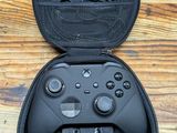 a close up of a nintendo wii controller in a case on a wooden floor