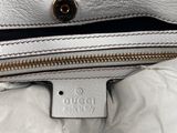 a close up of a white purse with a zipper on it