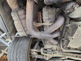 a close up of a car ' s exhaust pipe and exhaust pipe