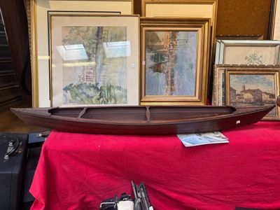 a boat that is sitting on a red table