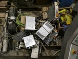 a pile of electronic equipment sitting on top of a pallet