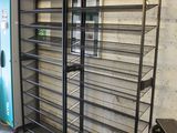 a room with a bunch of shelves and a blue door