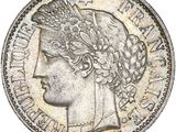 a close up of a coin with a woman ' s head on it