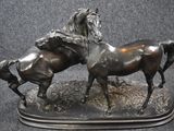 two horses that are standing next to each other