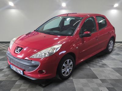 a picture of a red car that is parked in a garage