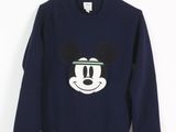 a close up of a sweater with a mickey mouse face on it