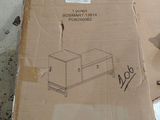 a cardboard box with a picture on it sitting on the ground