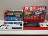a box with a toy car and other items on a table
