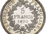 a silver five franc coin on a white background
