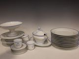 a lot of plates and bowls that are on the table
