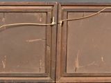 two old wooden windows with rope hanging from them