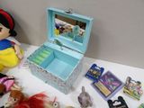 a small box with a mirror on top of a table filled with toys