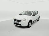 the small white car is parked in a white room