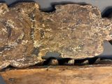a large piece of rock that is sitting on top of a piece of wood