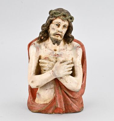 an image of a statue of jesus holding his hands together