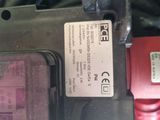 a close up of a red and black electrical device