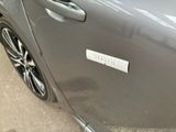 a close up of a car door with a sticker on it