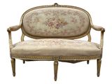 an image of a couch with a floral upholstered back and arms