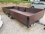 a trailer that is parked on the side of the road