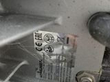 a close up of a metal object with a label on it