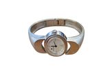 a silver watch that is sitting on a silver ring