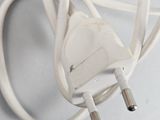 a white cord that is connected to a white power cord