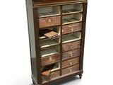 an old wooden cabinet with many drawers on it