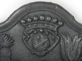 a metal headboard with a crown on top of it