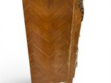 an antique wooden chest of drawers with a marble top