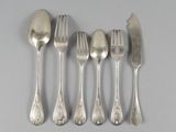 five forks and spoons are arranged in a row on a gray surface