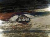 a close up of a metal object with a logo on it