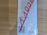a ticket with a red marker on it sitting on a table