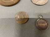 three coins are sitting on a table next to each other