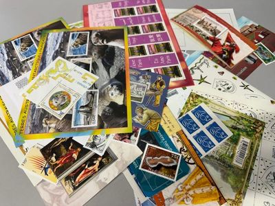 many different types of postcards on the table