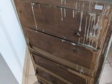 a very old wooden chest of drawers in a room