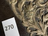a sign that says 20 on it in front of a picture of an ornate design
