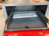 a keyboard and a mouse in a metal box
