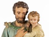 statue of jesus holding a child in his arms