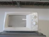 a microwave sitting on top of a microwave oven
