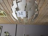 a light that is hanging from the ceiling in the room