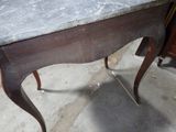 a marble top table with a marble top on top of it