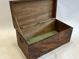 a wooden box with a green lid on a white surface