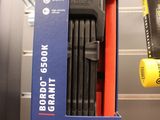 a blue box with a black handle and a red handle