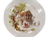 a plate with a picture of a house on it